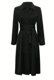 Black dress with a belt on a white background