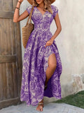 Woman wearing a purple floral dress with a wooden door and stone wall background