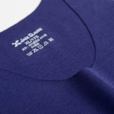 Close-up of a blue garment with a label on a white background