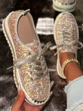 Glittery sneakers being held with a blurred background