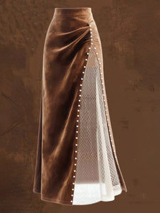 Brown velvet skirt worn by a person in an indoor setting
