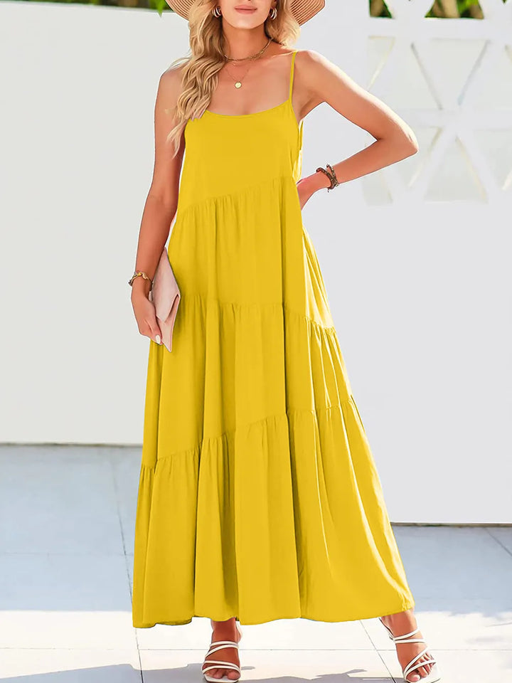 Woman wearing a yellow dress with a white background