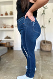 Person wearing blue jeans with a blurred background