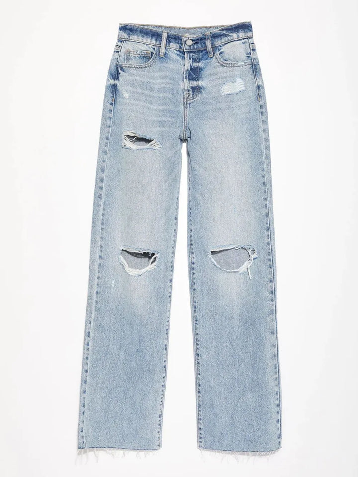 Light blue distressed jeans on a white background