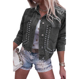 Person wearing a studded denim jacket and shorts on a white background