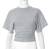 Gray crop top on a mannequin against a white background