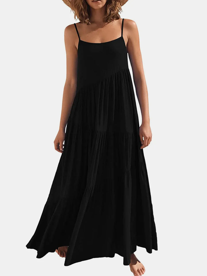 Woman wearing a black slip dress on a white background