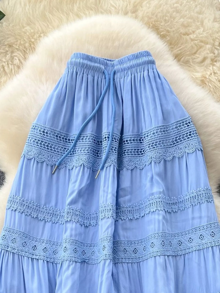 Light blue skirt with lace details on a fluffy white surface