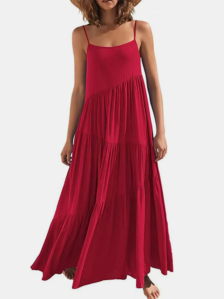 Red dress worn by a model on a white background