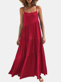 Red dress worn by a model on a white background