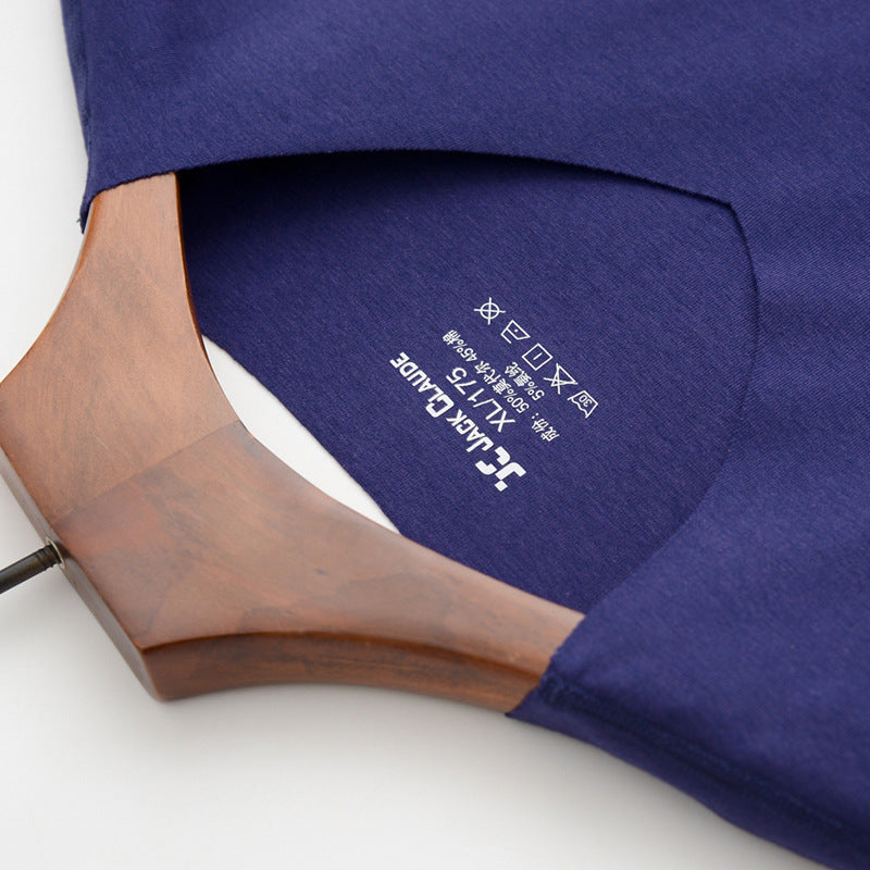 Close-up of a blue shirt with a brand logo on a white background