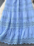 Light blue lace-trimmed dress on a textured surface