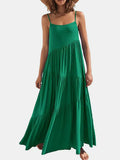Green dress worn by a person on a white background