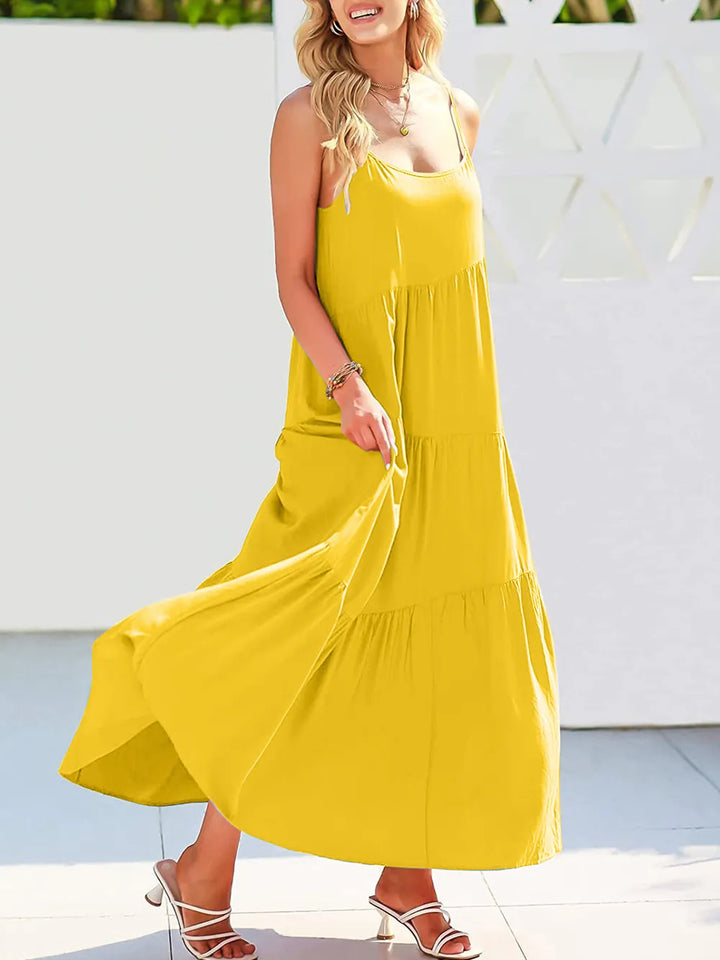 Woman wearing a yellow dress with a white background