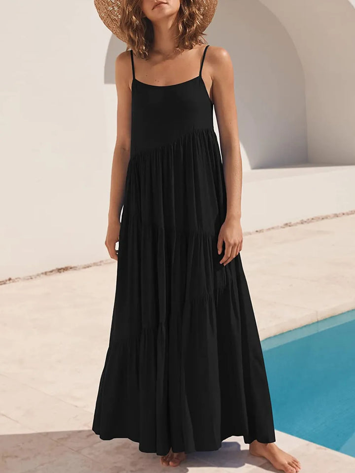 Woman wearing a black dress by a poolside