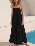 Woman wearing a black dress by a poolside