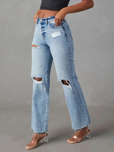 Light blue jeans on a beige background