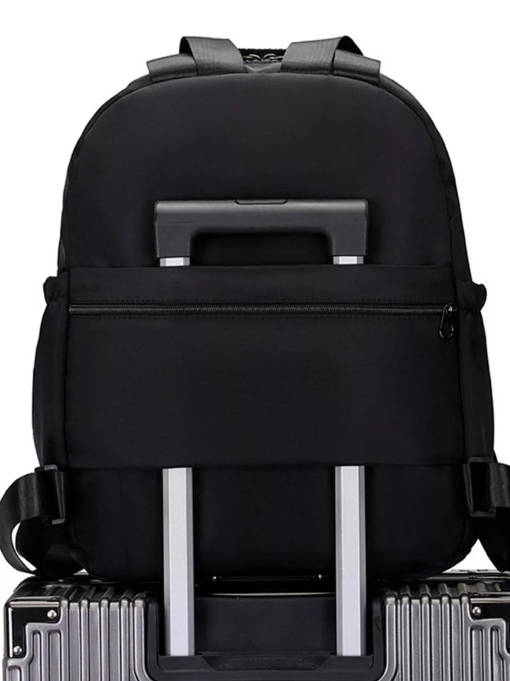 Black backpack with silver handles and wheels on a white background