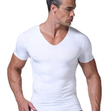Man wearing a white V-neck t-shirt on a plain background