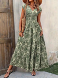 Woman wearing a green floral dress against a wooden door and stone wall background